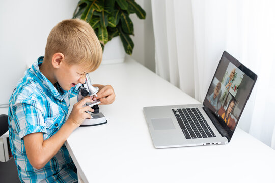 Smart Young Boy Works on a Laptop For His New Project in His Computer Science Class.