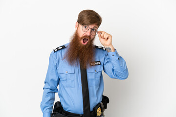 Redhead police man isolated on white background with glasses and happy