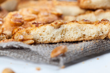 on the surface of a round cookie caramel with peanuts