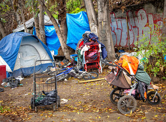 A homeless encampment on the side of a road - obrazy, fototapety, plakaty