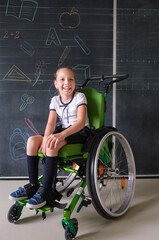 Special child on wheelchair. Girl in school uniform on the background of the school board.