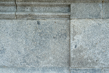 Granite wall with moldings on the facade of a building. Gray granite texture vector background