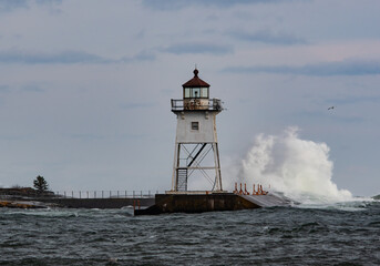 Waves crashing at lighthouse on Lake Superior, Minnesota