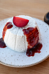 Cheese collection, white Italian soft cheese ricotta served as sweet dessert with homemade plum jam