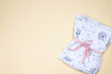 A set of fabric muslin nappies. Eco-friendly cloth diapers for newborns. Baby hygiene concept.