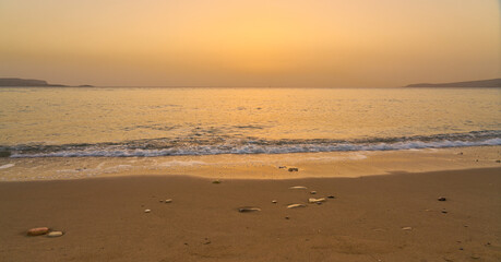 Sandy tropical beach at dawn in Crete.