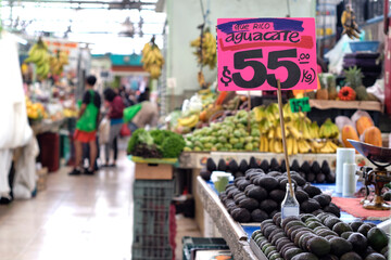 .Mexican market shows sale of avocados in Mexican pesos