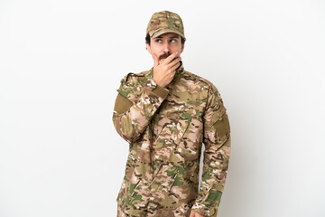 Soldier man isolated on white background having doubts and with confuse face expression