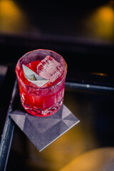 Red Cocktail and paper ship