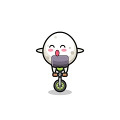 The cute onigiri character is riding a circus bike