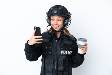 SWAT Russian woman isolated on white background holding coffee to take away and a mobile