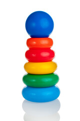 A children's pyramid is a few rings worn on a rod, which are placed on a cone of various colors and shapes, isolated on a white background