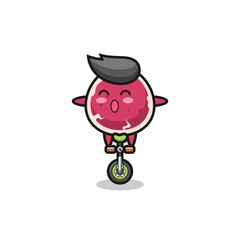 The cute beef character is riding a circus bike