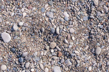 colorful little pebbles on the seashore, sand and gravel,
