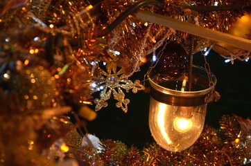 Decorated christmas tree night in new year or party. Magic shining christmas tree sparkle gold. Space for text