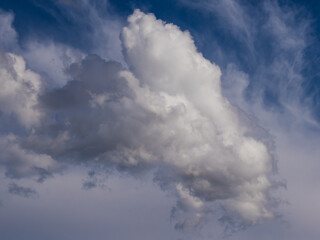 cloudscape with white clouds in a blue sky