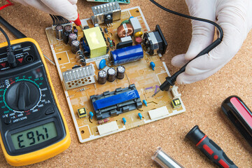 Technician checks the electronic device