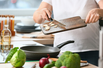 Mature woman cooking in kitchen