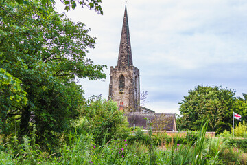 Ancient gothic spire in the countryside of England - obrazy, fototapety, plakaty
