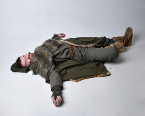 
Full length  portrait of  young handsome man  wearing  medieval Celtic adventurer costume with...