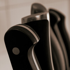 Closeup shot of knife butts on a blurred background © Christian Åkerberg/Wirestock
