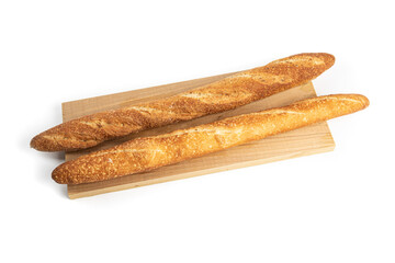 Two crusty bread French sticks or baguettes on a wooden board isolated on white
