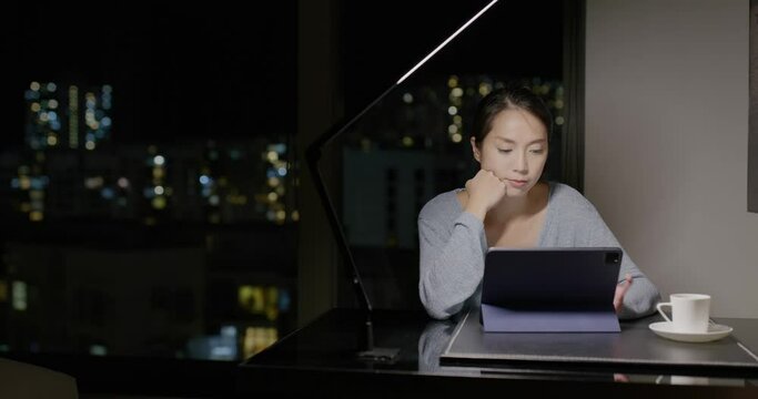 Woman watch on tablet computer at home