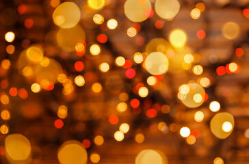 Christmas and New Year holidays background. Festive bokeh background. Abstraction and background. Defocus effect. Blurred bokeh light background. Bokeh from the lights of a garland. Festive mood.