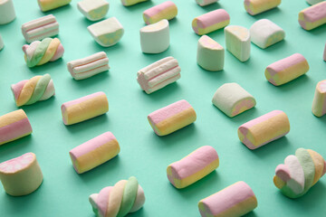 Tasty marshmallows on color background