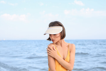 Beautiful young woman on sea beach