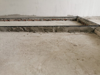 setup level for slope ground, distance for stone and water to make floor, the construction site before the concrete was poured.