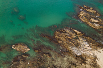 High angle view Tropical sea with wave crashing on seashore and high mountain located in Phuket Thailand aerial view drone top down Amazing nature view landscape Beautiful sea surface.