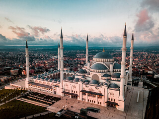 Suleymaniye Mosque surrounded by buildings in the evening in Istanbul, Turkey