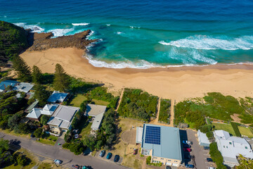 Blue ocean with large waves crashing on to North Avoca Shoreline in  New South Wales Australia