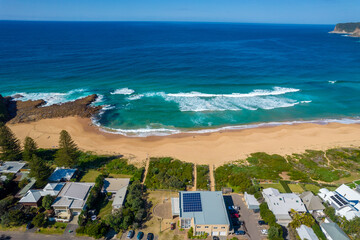 Blue ocean with large waves crashing on to North Avoca Shoreline in  New South Wales Australia