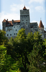 Fototapeta na wymiar Medieval Bran Castle on mountain in Brasov, Romania