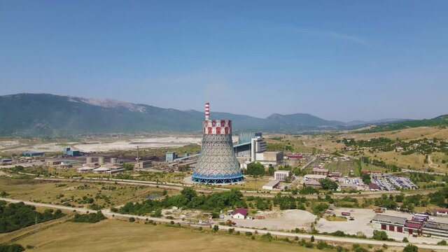 Gacko Thermal Coal Power Plant, Bosnia and Herzegovina. Aerial View of a Cooling Tower, Chimney and Facility on Sunny Summer Day