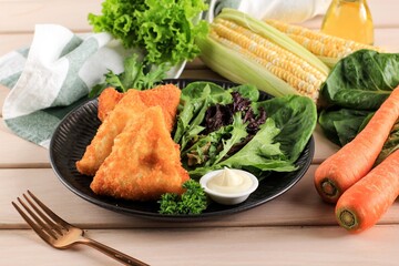 Vegetarian Samsa (Samosas) in Triangle Shape with Tomato Sauce and Mayonaise. Popular in Indonesia as Risoles  Sayur. (Vegetable Risol)