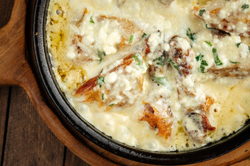 Closeup on georgian chkmeruli chicken dish with cream sauce
