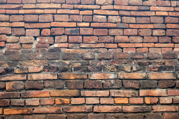 Obraz premium Antique old brick wall background and texture in Thailand
