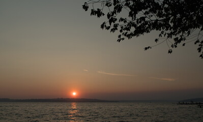 Fototapeta na wymiar Smoky sunset over Houghton beach