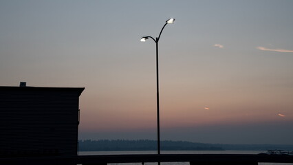 Street light and smoky sunset near marina in Kirkland