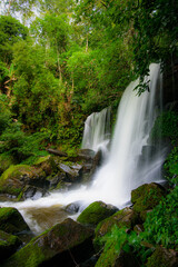 Waterfall rocks with green moss. deep forest at center of the forest in thailand