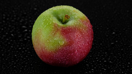 fresh apple close up on black background