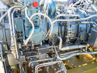 Close-up of the new engine for the ship. Mechanism with a bunch of pipes and parts