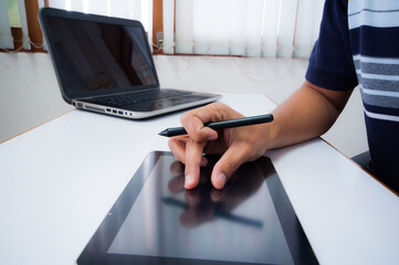 businessman working with business documents on office table with digital tablet computer. Work from home.