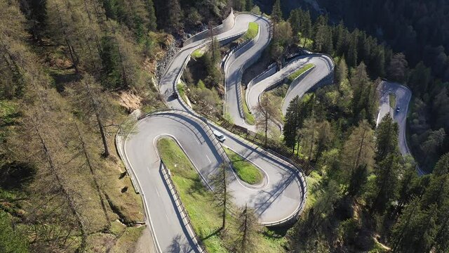Aerial footage of the Maloja pass winding road in the Engadine region of Canton Graubunden in the alps in Switzerland