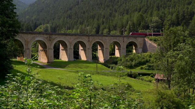 Beautiful viaduct at Semmering Railway in Austria with train passing through