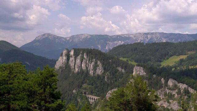 Timelapse of beautiful mountain landscape during summer with moving clouds
