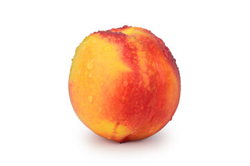 Red-yellow ripe nectarine in water droplets with a slight shadow underneath